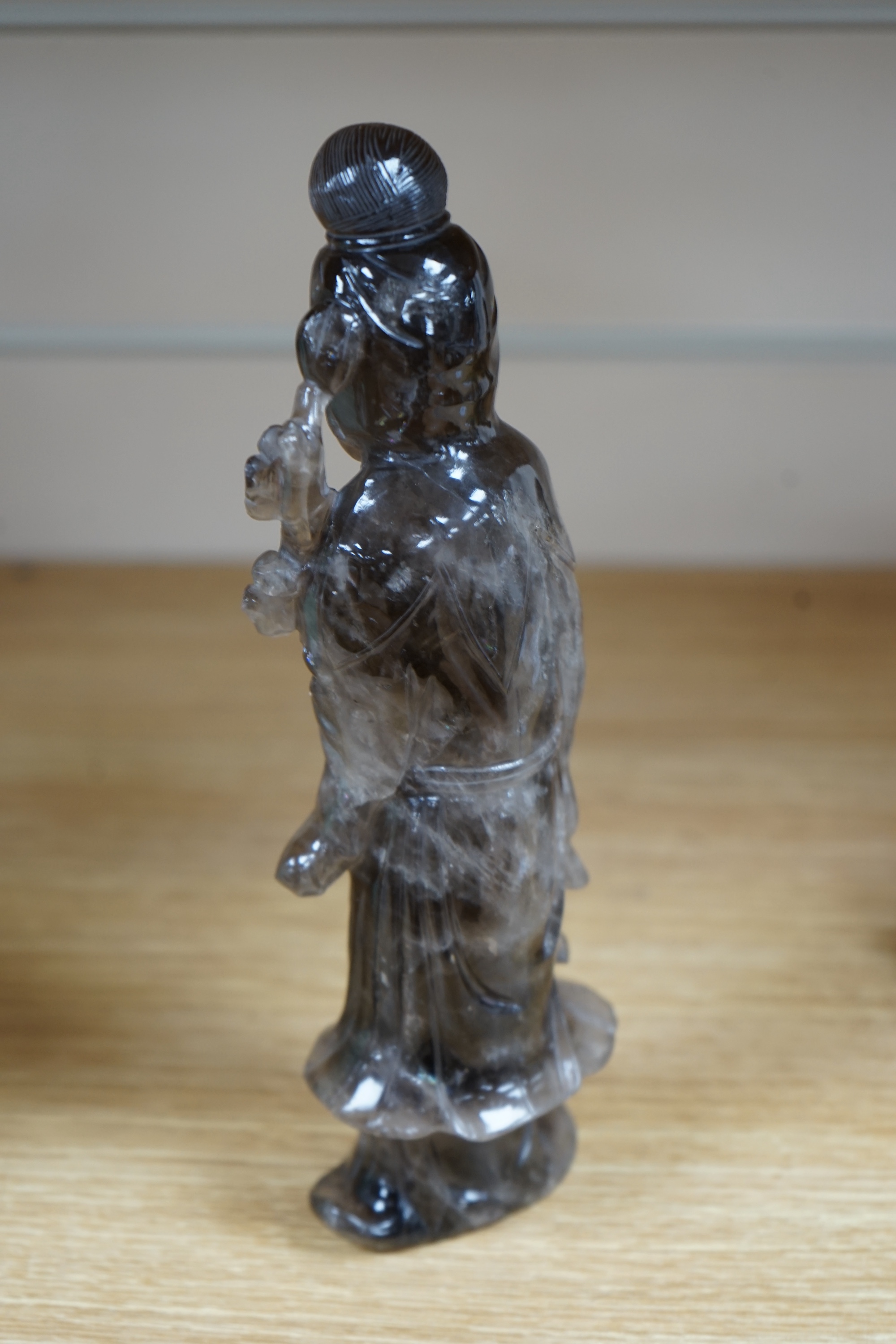 A Chinese smoky quartz figure of Guanyin, 23cm. Condition - fair to good